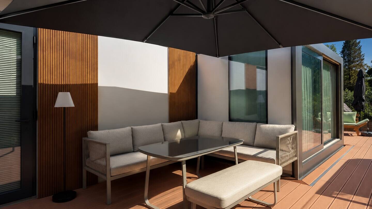 Terrace with lounge furniture and parasol